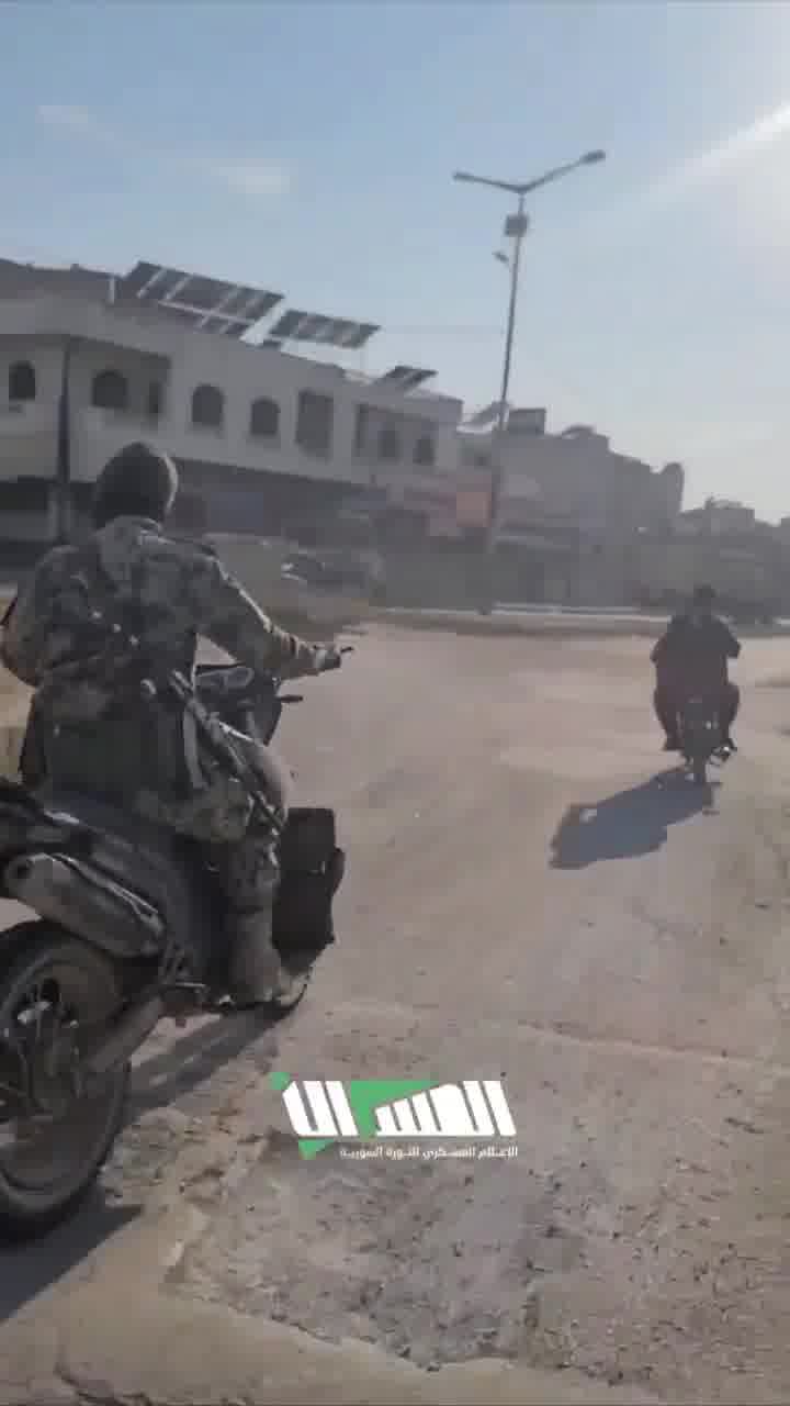 The streets of Hama following the rebel-takeover. Residents gather at intersections to greet rebel forces as they enter they city