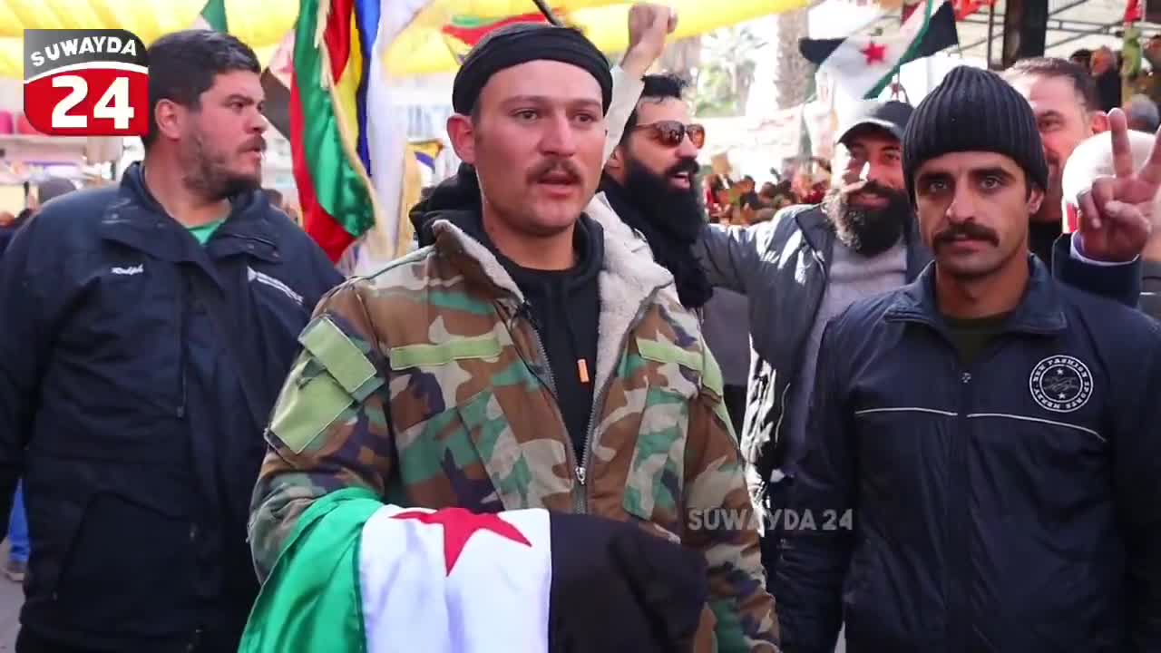 A member of the Syrian army announces his defection in Al-Karamah Square in the center of Sweida in an interview with the Sweida 24 camera, and confirms that the civil groups worked to secure and protect him.