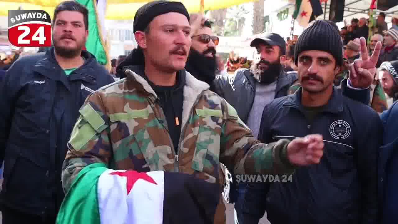 A member of the Syrian army announces his defection in Al-Karamah Square in the center of Sweida in an interview with the Sweida 24 camera, and confirms that the civil groups worked to secure and protect him.