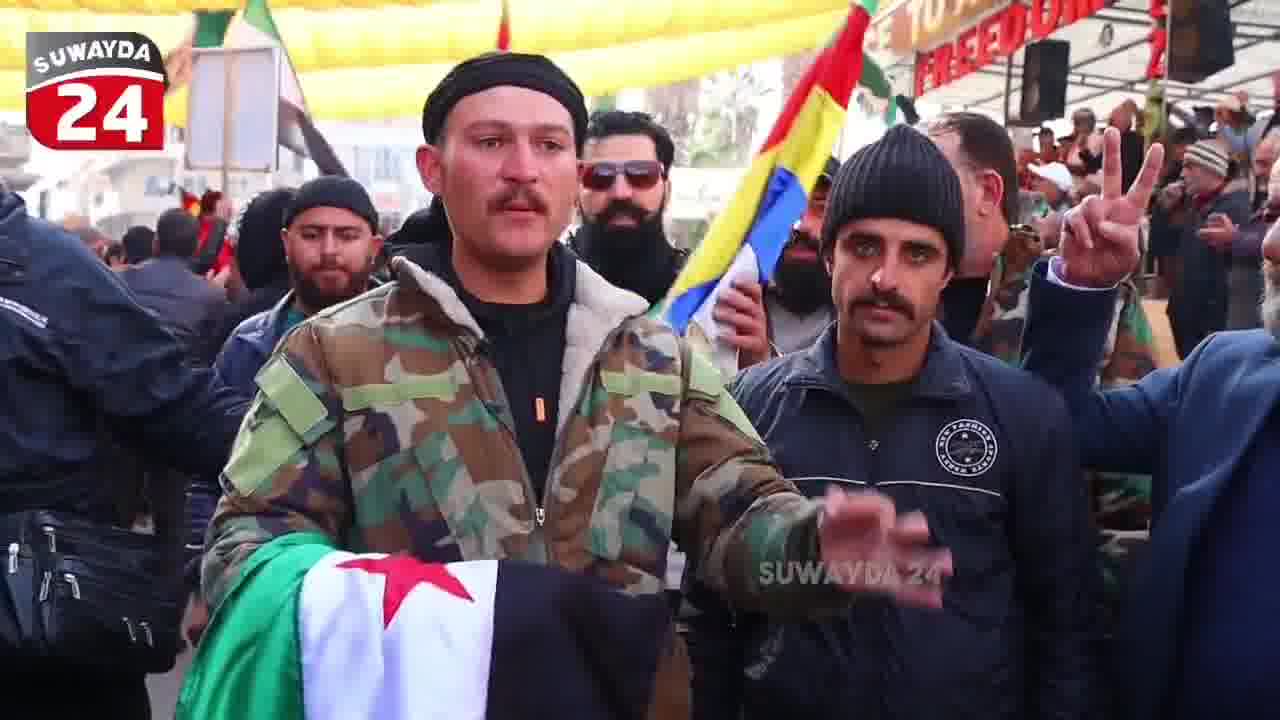 A member of the Syrian army announces his defection in Al-Karamah Square in the center of Sweida in an interview with the Sweida 24 camera, and confirms that the civil groups worked to secure and protect him.