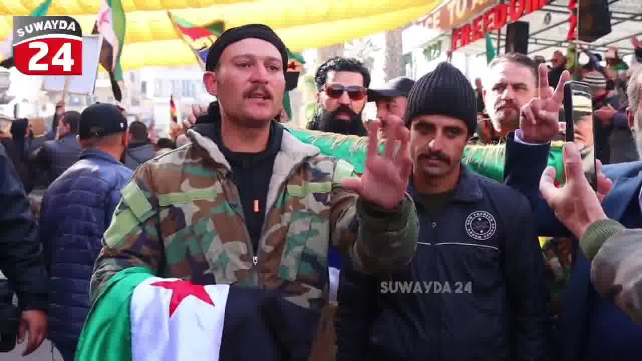 A member of the Syrian army announces his defection in Al-Karamah Square in the center of Sweida in an interview with the Sweida 24 camera, and confirms that the civil groups worked to secure and protect him.