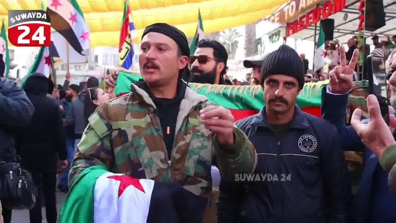 A member of the Syrian army announces his defection in Al-Karamah Square in the center of Sweida in an interview with the Sweida 24 camera, and confirms that the civil groups worked to secure and protect him.