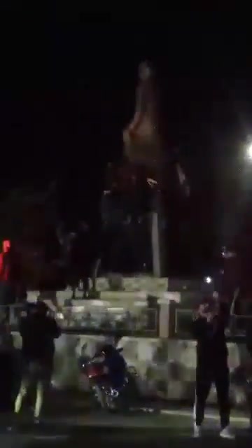 Statue of Hafez al-Assad falling again in the center of Daraa city after the rebels controlled the city