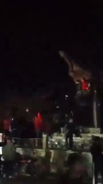 Statue of Hafez al-Assad falling again in the center of Daraa city after the rebels controlled the city