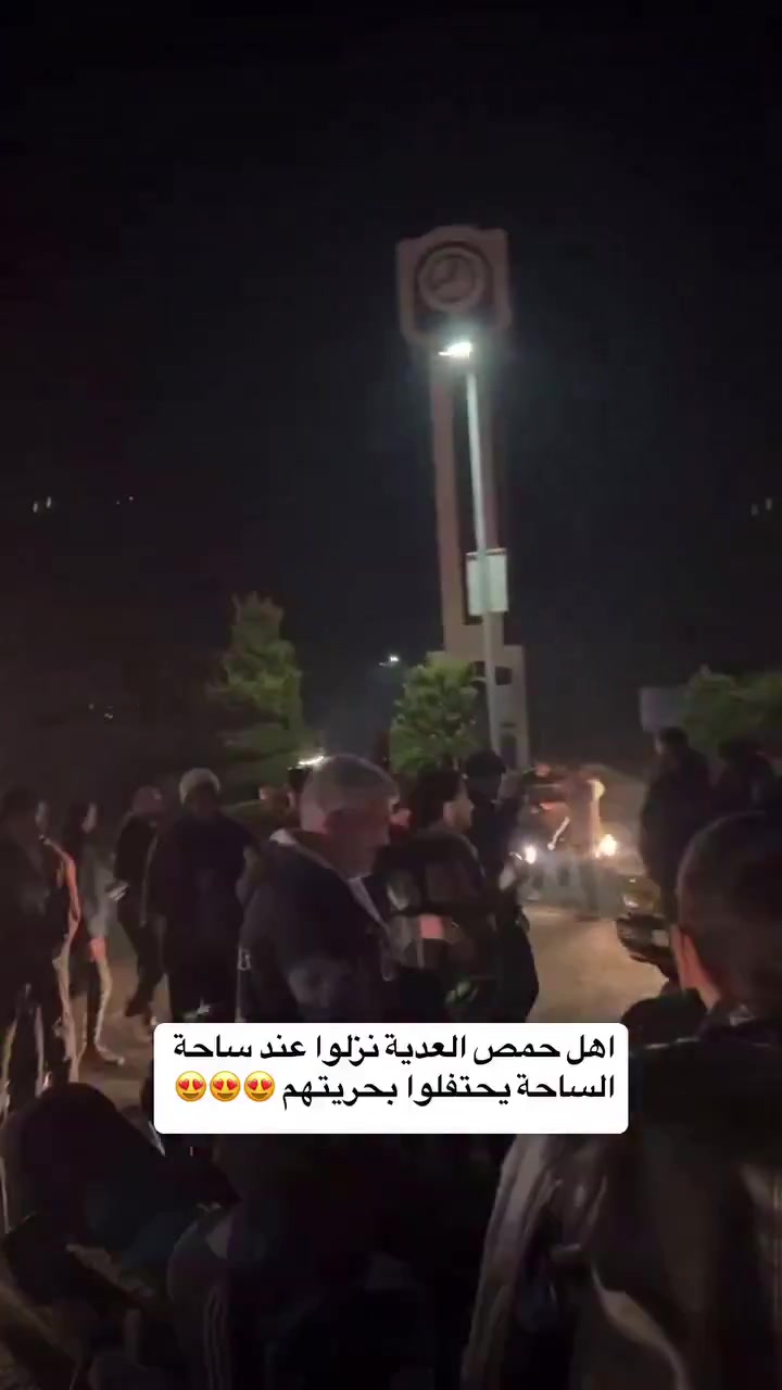 Celebration in the center of Homs, in the Clock Square