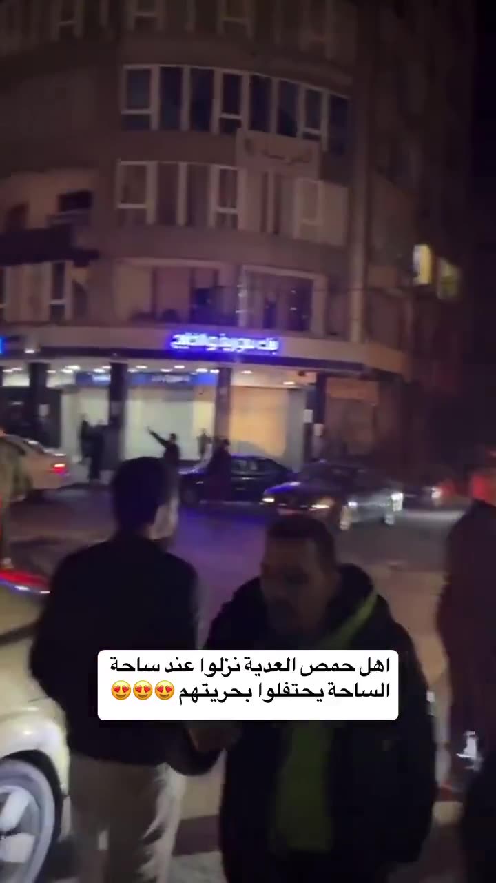 Celebration in the center of Homs, in the Clock Square