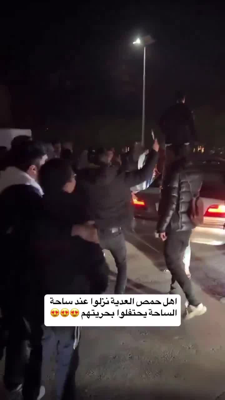 Celebration in the center of Homs, in the Clock Square