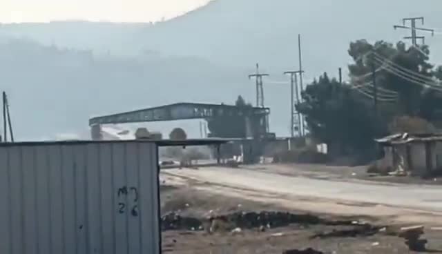 This video captures an SNA convoy attempting to cross the Qaraqozak Bridge but ultimately being repelled, forcing them to abandon their armored vehicle