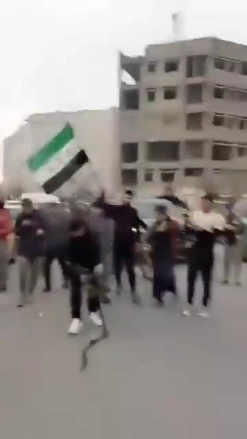 Kurdish sources claim that they are not behind shooting protesters in Raqqa and post this video to demonstrate that someone amongst the protesters is holding a PKC machine gun shooting