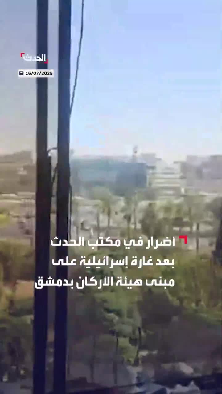 Broken glass and debris at the scene at Al Hadath office in Damascus