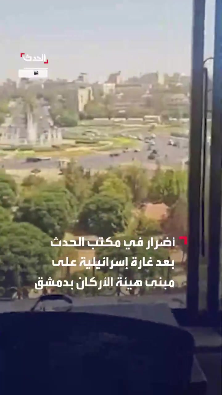 Broken glass and debris at the scene at Al Hadath office in Damascus