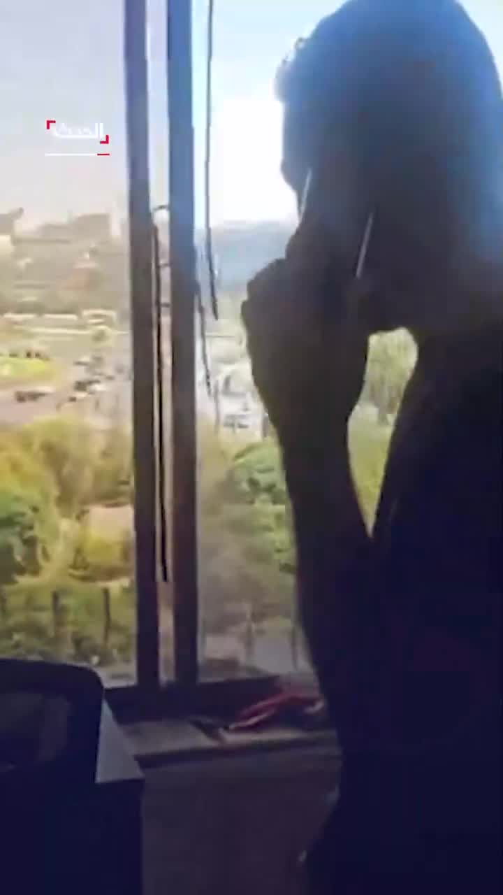 Broken glass and debris at the scene at Al Hadath office in Damascus