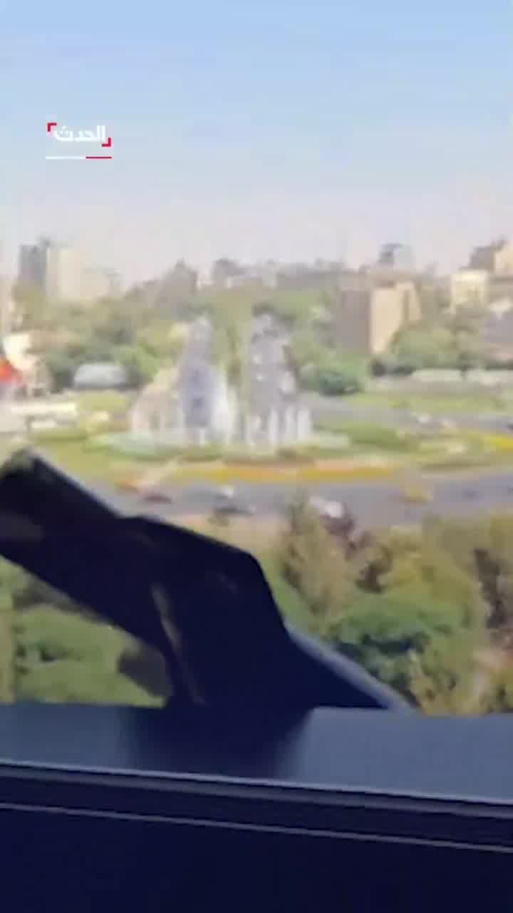 Broken glass and debris at the scene at Al Hadath office in Damascus