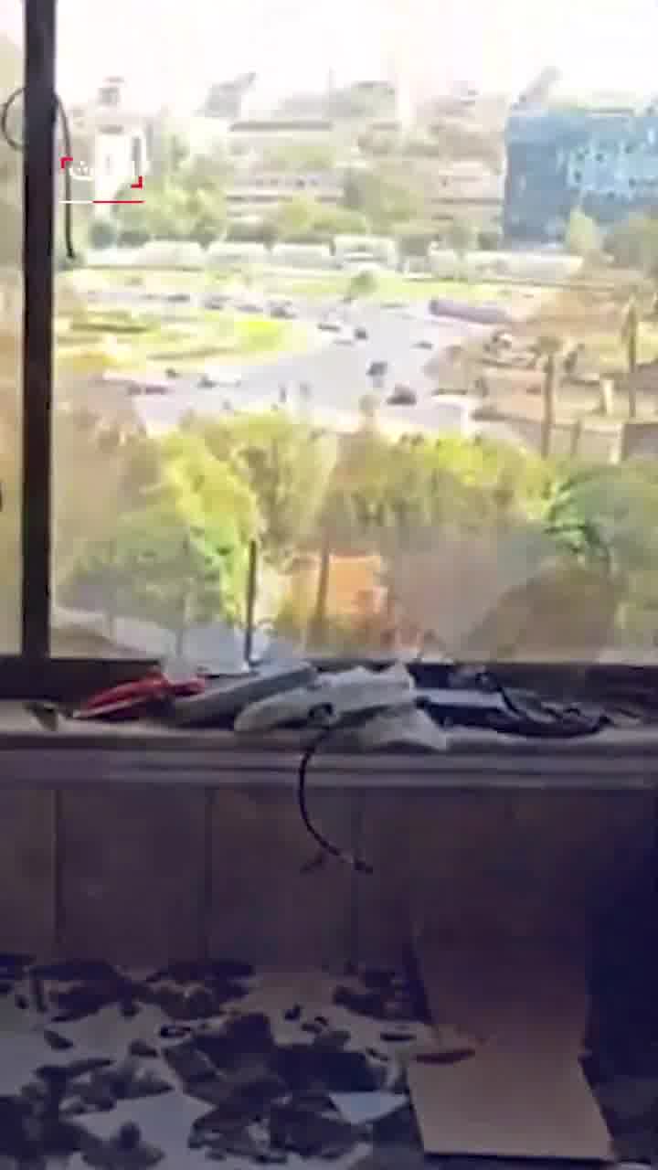 Broken glass and debris at the scene at Al Hadath office in Damascus