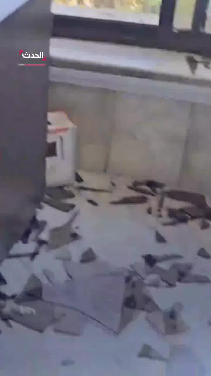 Broken glass and debris at the scene at Al Hadath office in Damascus