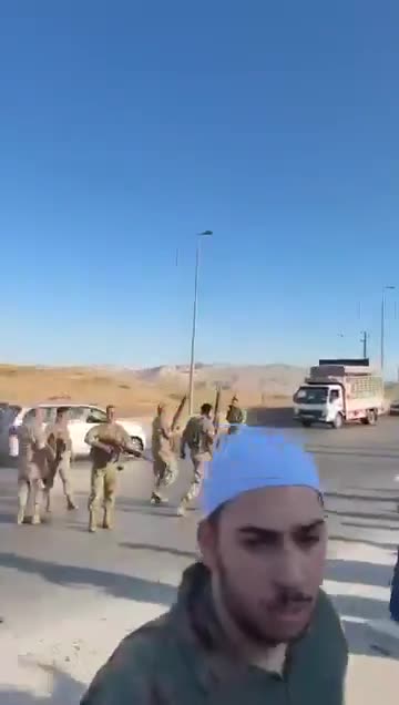 Lebanese army personnel prevent Druze from advancing to the Syrian border.