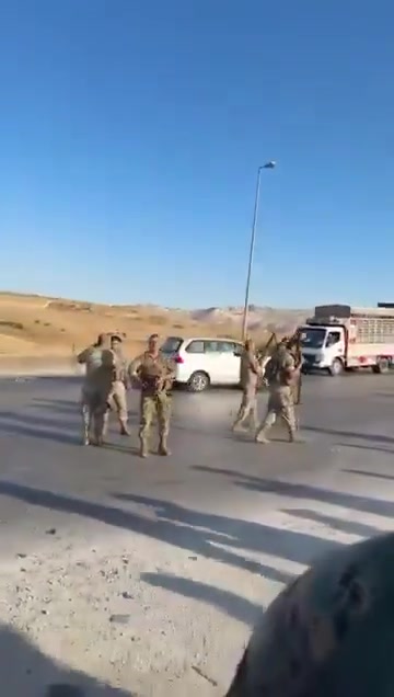 Lebanese army personnel prevent Druze from advancing to the Syrian border.