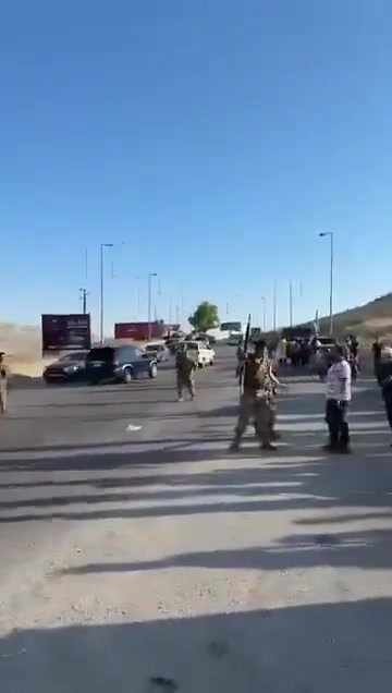 Lebanese army personnel prevent Druze from advancing to the Syrian border.