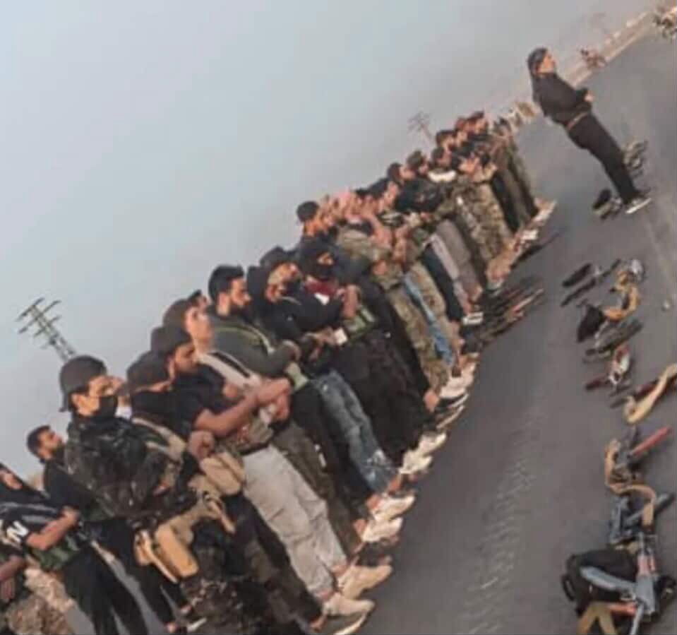 Hawran Mujahideen perform the Maghrib prayer before entering the Mazra'a area in As-Suwayda Governorate.