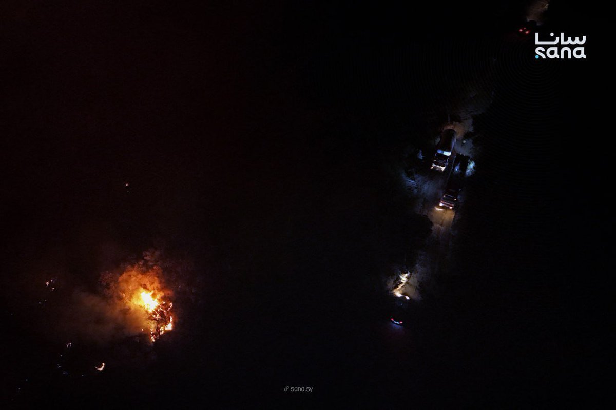 Civil defense teams continue their efforts to extinguish a fire that broke out in Jabal al-Turkman in the Latakia countryside.