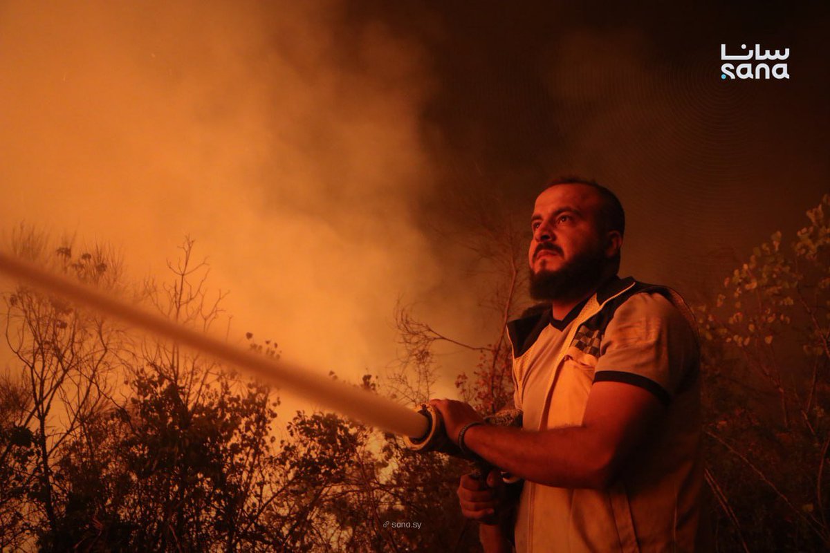 Civil defense teams continue their efforts to extinguish a fire that broke out in Jabal al-Turkman in the Latakia countryside.