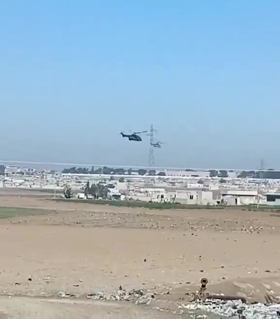 Now that the transfer to Iraq is confirmed, the helicopter activity over Hasakah continues. A Tiger attack helicopter is seen providing escort. This Caracal helicopter, skimming the rooftops—a remarkable feat—is potentially transferring ISIS prisoners from Ghouiran prison in Hasakah.