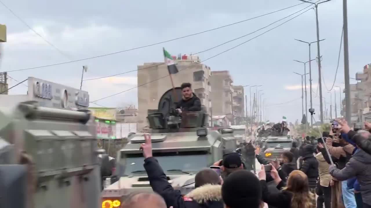 Syrian interior ministry forces enter the city of Qamishili in the Kurdish region in northeast Syria as people chant “long live the struggle of Rojava”