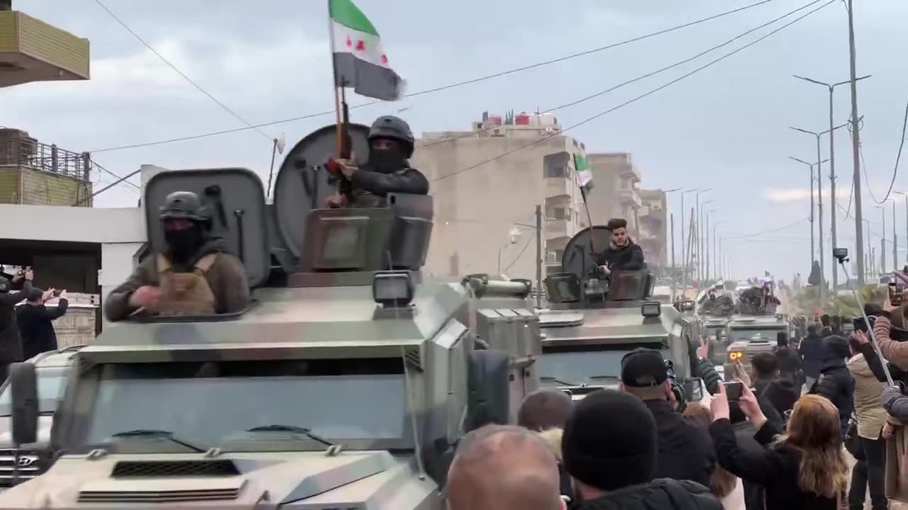 Syrian interior ministry forces enter the city of Qamishili in the Kurdish region in northeast Syria as people chant “long live the struggle of Rojava”