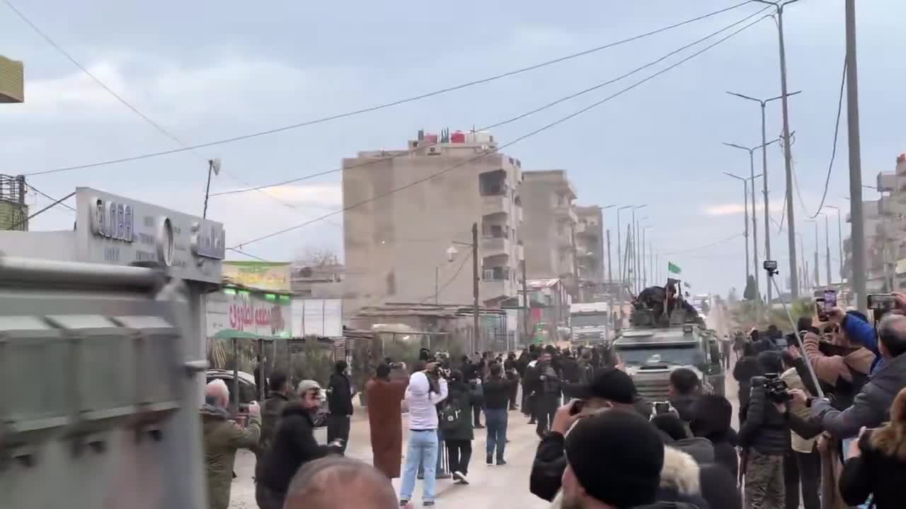 Syrian interior ministry forces enter the city of Qamishili in the Kurdish region in northeast Syria as people chant “long live the struggle of Rojava”