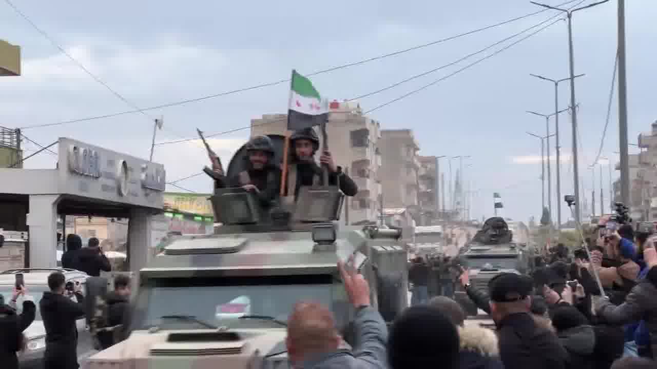 Syrian interior ministry forces enter the city of Qamishili in the Kurdish region in northeast Syria as people chant “long live the struggle of Rojava”